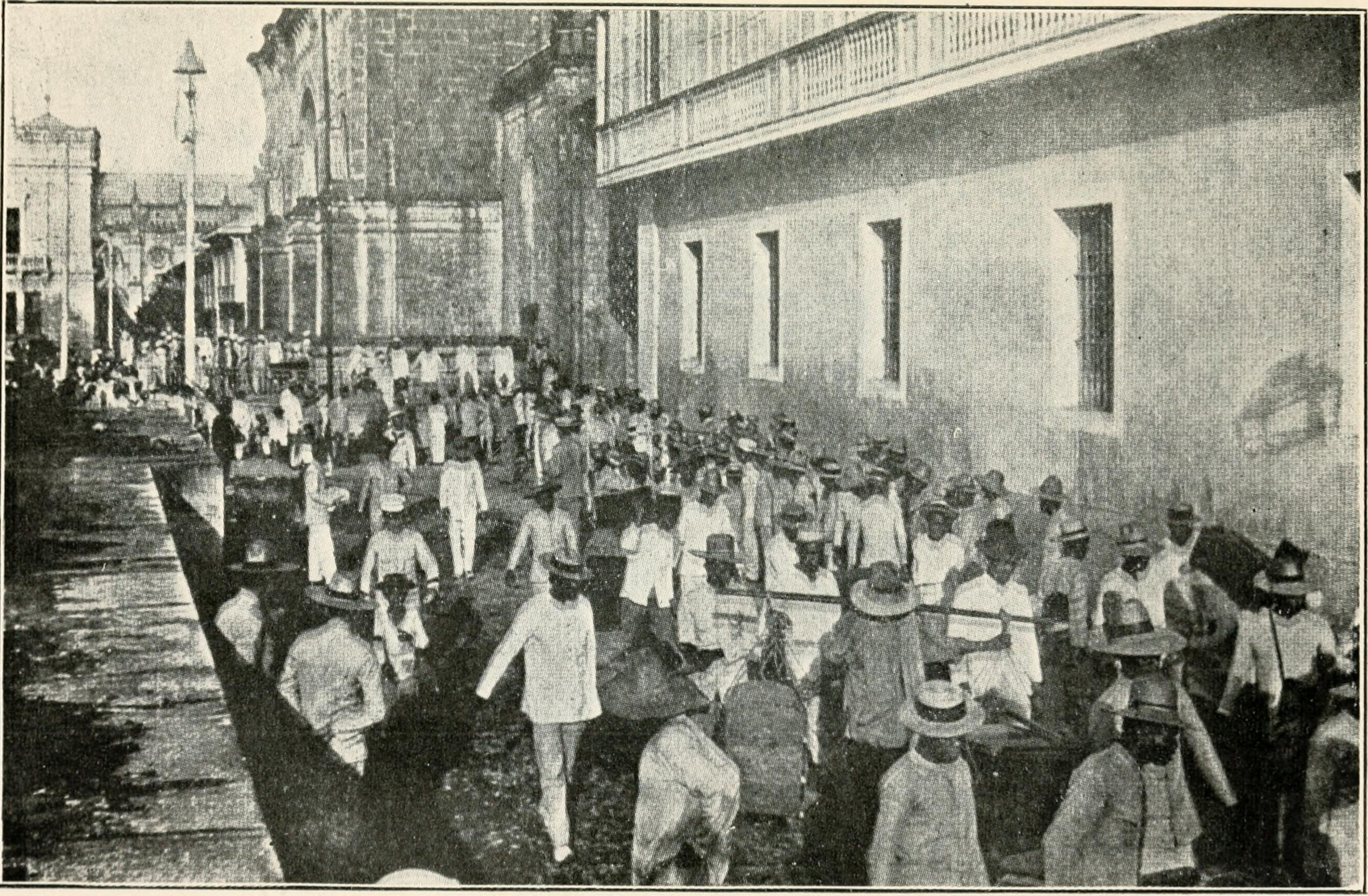 image of workers in the street from 'A Story From the Philippines (1902)'